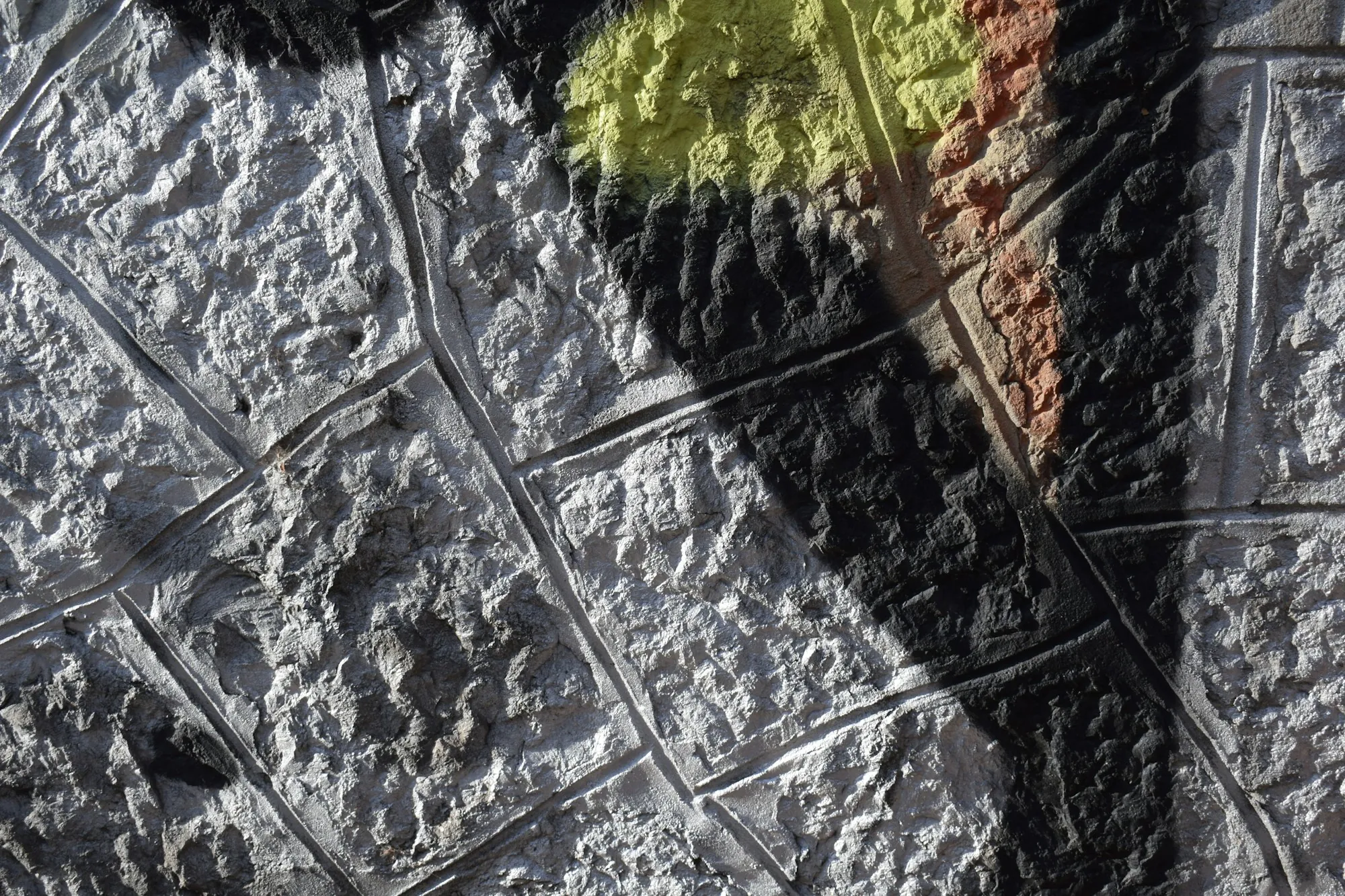 Textured gray stamped concrete close up